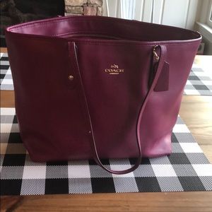 Never used plum colored Coach purse!
